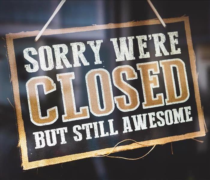 A sign on a business door titled, "Sorry, we're closed, but still awesome" 